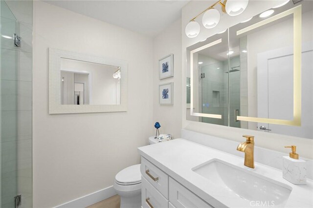 663 Via Los Altos Unit Q, Laguna Woods, CA 92637 - full bathroom with a shower stall, toilet, vanity, and baseboards