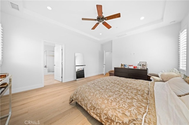 63 Birmingham, Irvine, CA 92620 - bedroom featuring a tray ceiling, wood finished floors, recessed lighting, and baseboards