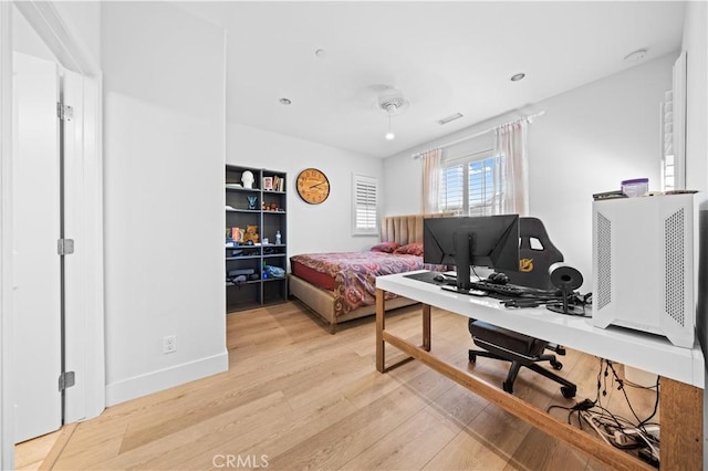 63 Birmingham, Irvine, CA 92620 - bedroom featuring light wood-style flooring, an office area, and baseboards