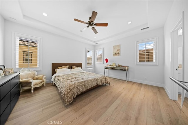 63 Birmingham, Irvine, CA 92620 - bedroom with a tray ceiling, light wood-type flooring, multiple windows, recessed lighting, and baseboards