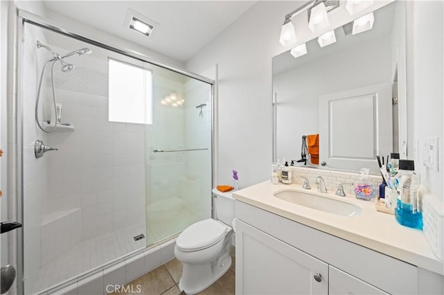 63 Birmingham, Irvine, CA 92620 - bathroom featuring toilet, a shower stall, vanity, and tile patterned floors