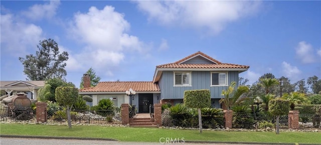 20015 Winton St, Corona, CA 92881 - view of front of home with a tiled roof and a chimney