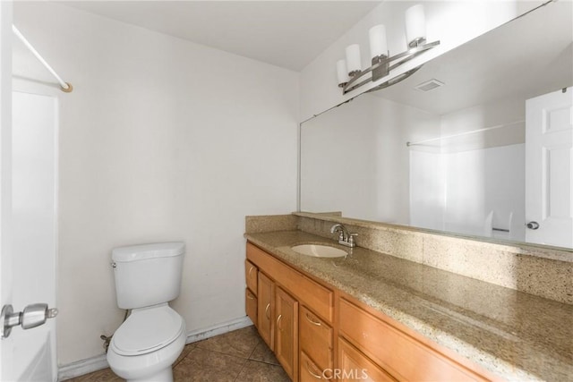 14735 Perham Dr, Moreno Valley, CA 92553 - bathroom featuring a shower, toilet, vanity, tile patterned floors, and baseboards