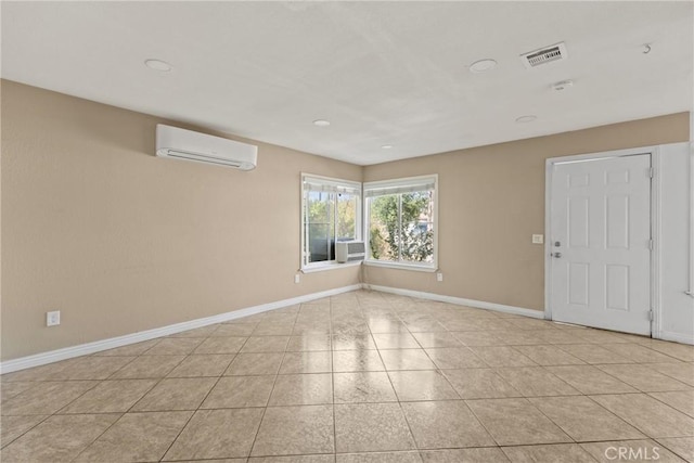 14735 Perham Dr, Moreno Valley, CA 92553 - tiled empty room featuring an AC wall unit, baseboards, and recessed lighting