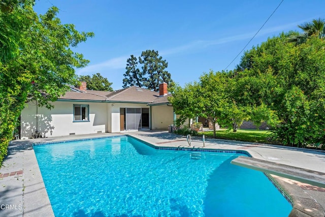 pool featuring a patio area