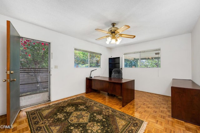 office space featuring ceiling fan