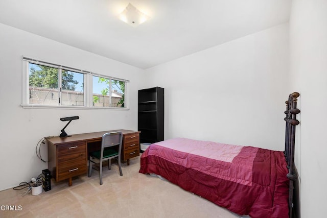 bedroom with light colored carpet