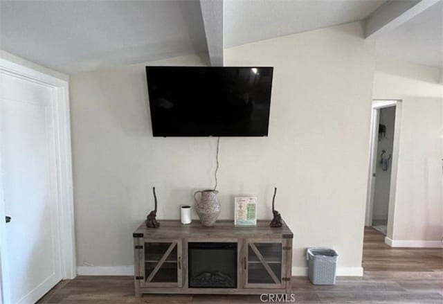 room details with wood finished floors, baseboards, and beamed ceiling