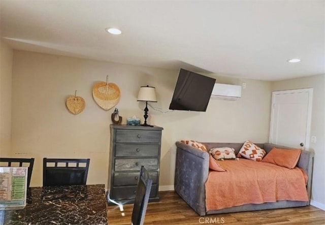 bedroom featuring baseboards, recessed lighting, and wood finished floors