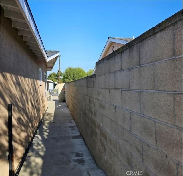 view of side of property with fence