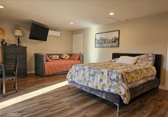 bedroom featuring wood finished floors, baseboards, and recessed lighting