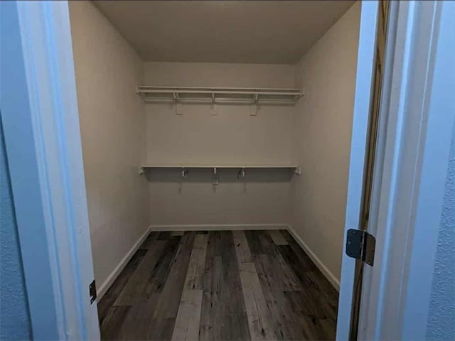 68430 Concepcion Rd, Cathedral City, CA 92234 - spacious closet featuring dark wood-style flooring