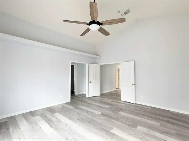 68430 Concepcion Rd, Cathedral City, CA 92234 - spare room with lofted ceiling, wood finished floors, visible vents, a ceiling fan, and baseboards