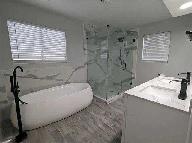68430 Concepcion Rd, Cathedral City, CA 92234 - full bath with a marble finish shower, a sink, wood tiled floor, a soaking tub, and tile walls