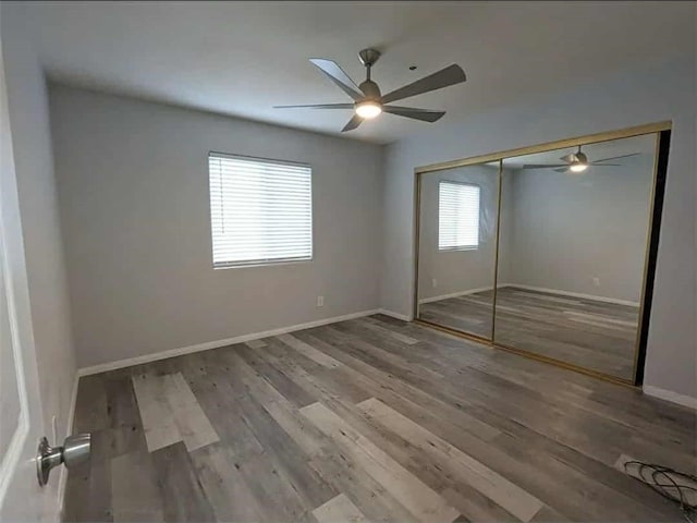 68430 Concepcion Rd, Cathedral City, CA 92234 - unfurnished bedroom with a closet, baseboards, a ceiling fan, and wood finished floors