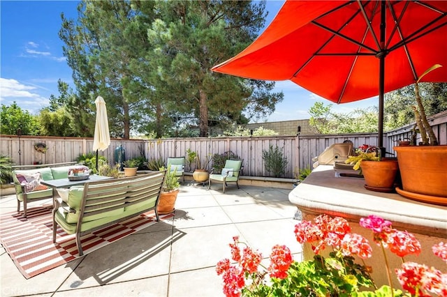 view of patio / terrace featuring outdoor dining area and a fenced backyard