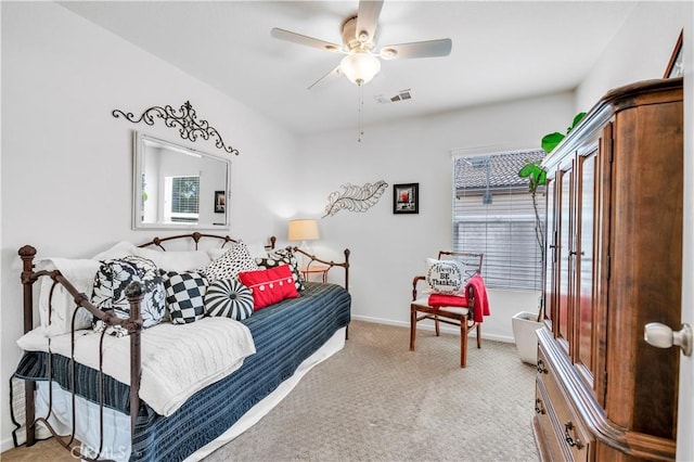 bedroom with light carpet, baseboards, a ceiling fan, and visible vents