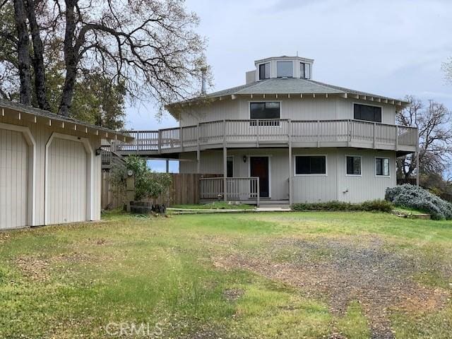 back of property with a yard