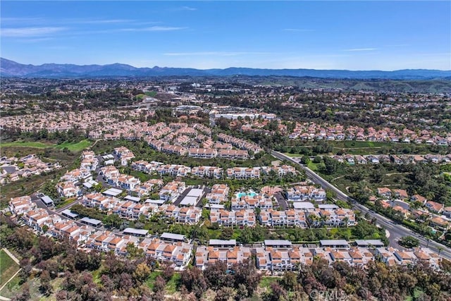 birds eye view of property featuring a mountain view and a residential view