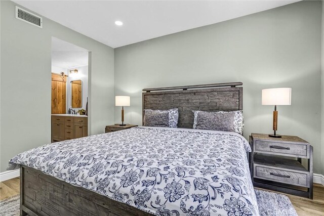 bedroom featuring recessed lighting, baseboards, visible vents, and wood finished floors
