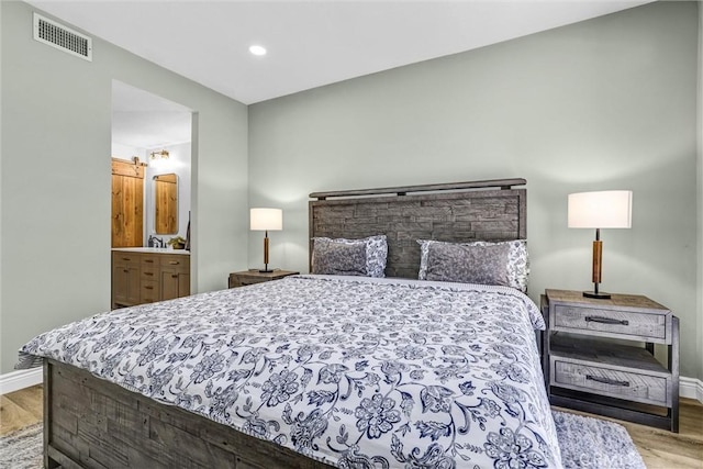 28215 Via Luis, Laguna Niguel, CA 92677 - bedroom with wood finished floors, baseboards, recessed lighting, and ensuite bath