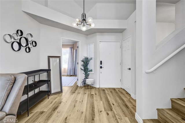 28215 Via Luis, Laguna Niguel, CA 92677 - foyer entrance featuring light wood-style floors, a chandelier, stairs, and baseboards