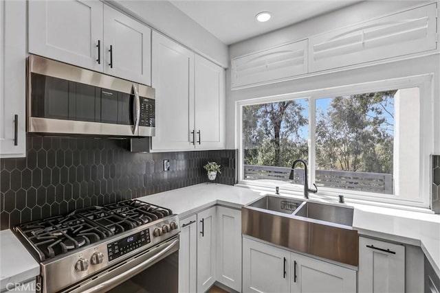 28215 Via Luis, Laguna Niguel, CA 92677 - kitchen with appliances with stainless steel finishes, a sink, tasteful backsplash, light countertops, and recessed lighting