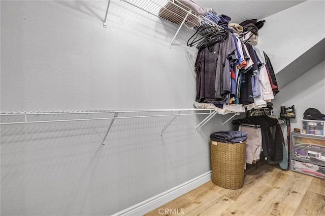 spacious closet with wood finished floors