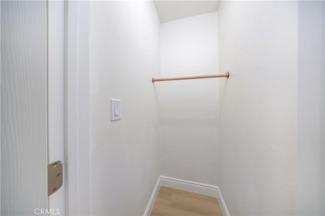 737 Lewis St, Pomona, CA 91768 - spacious closet with light wood-style flooring