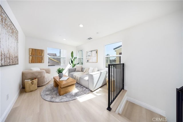 737 Lewis St, Pomona, CA 91768 - living room with baseboards, visible vents, and wood finished floors