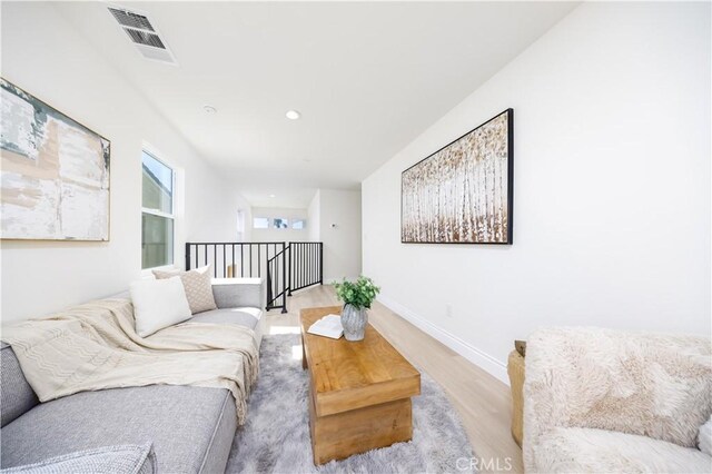 737 Lewis St, Pomona, CA 91768 - living room featuring baseboards, light wood-type flooring, visible vents, and recessed lighting