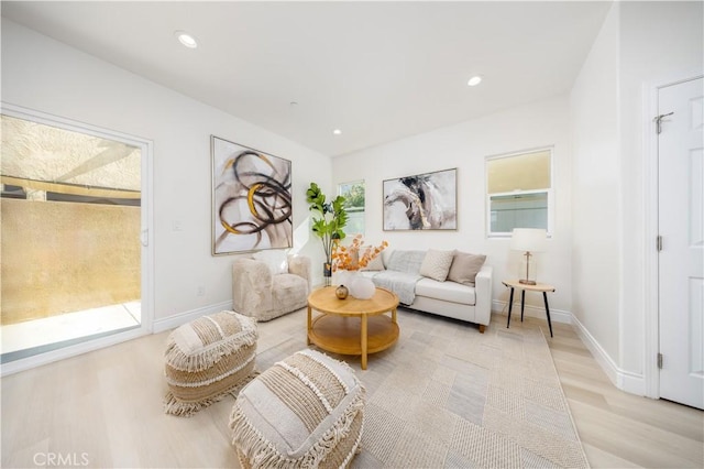 737 Lewis St, Pomona, CA 91768 - living room featuring light wood-style floors, baseboards, and recessed lighting