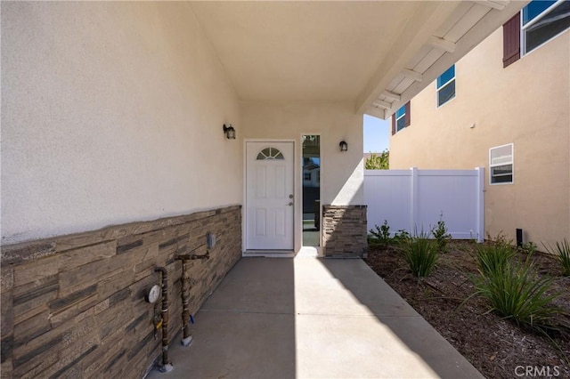 737 Lewis St, Pomona, CA 91768 - view of exterior entry featuring fence and stucco siding