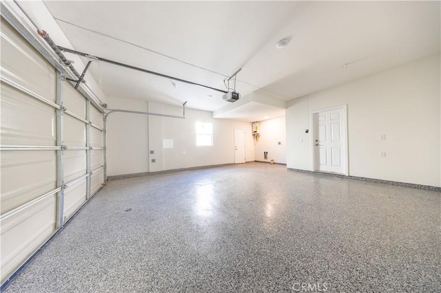 737 Lewis St, Pomona, CA 91768 - garage with baseboards and a garage door opener