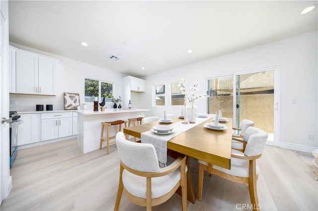 737 Lewis St, Pomona, CA 91768 - dining space featuring light wood finished floors, visible vents, and recessed lighting