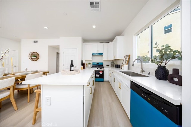 737 Lewis St, Pomona, CA 91768 - kitchen with dishwasher, visible vents, a sink, stainless steel range with gas cooktop, and light wood-type flooring