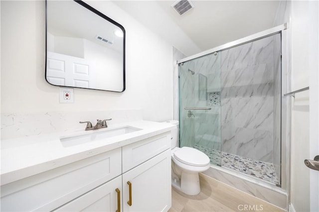 737 Lewis St, Pomona, CA 91768 - full bathroom featuring vanity, toilet, a marble finish shower, and visible vents