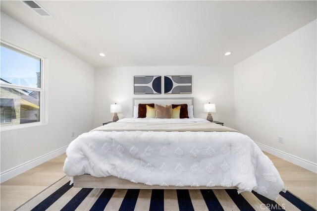 737 Lewis St, Pomona, CA 91768 - bedroom with recessed lighting, light wood-style flooring, and visible vents