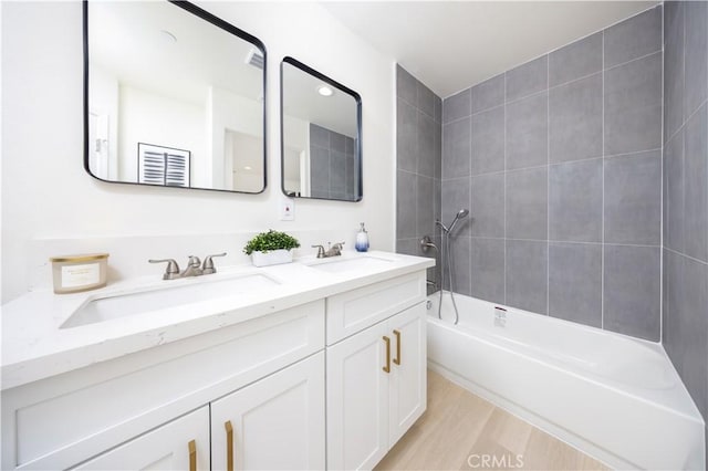 737 Lewis St, Pomona, CA 91768 - full bath featuring a sink, double vanity, and bathing tub / shower combination