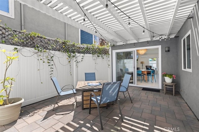 view of patio featuring outdoor dining space, a pergola, and a fenced backyard