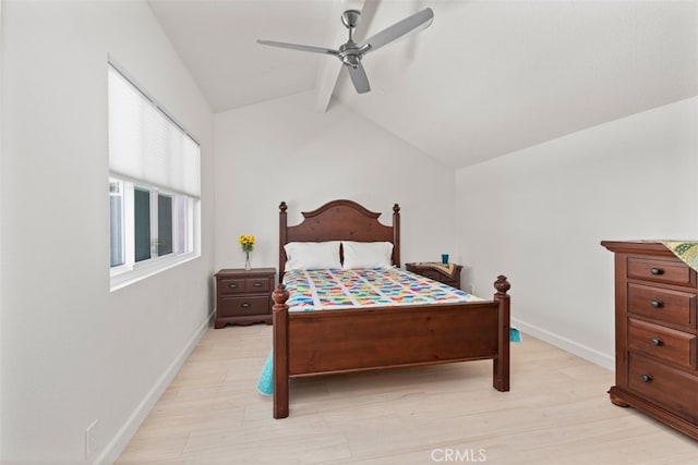 bedroom featuring baseboards, light wood-style flooring, ceiling fan, and vaulted ceiling with beams