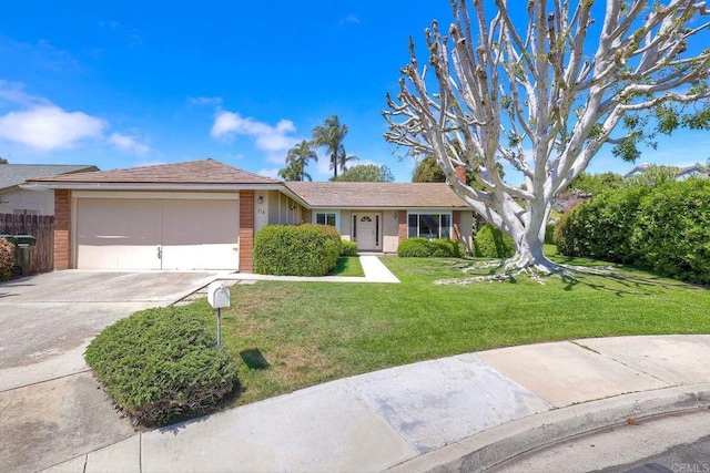 ranch-style house featuring a front yard, brick siding, driveway, and a garage