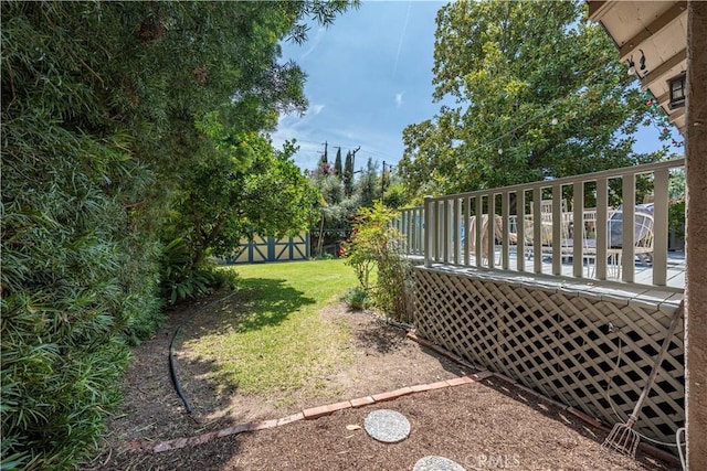 view of yard with a wooden deck