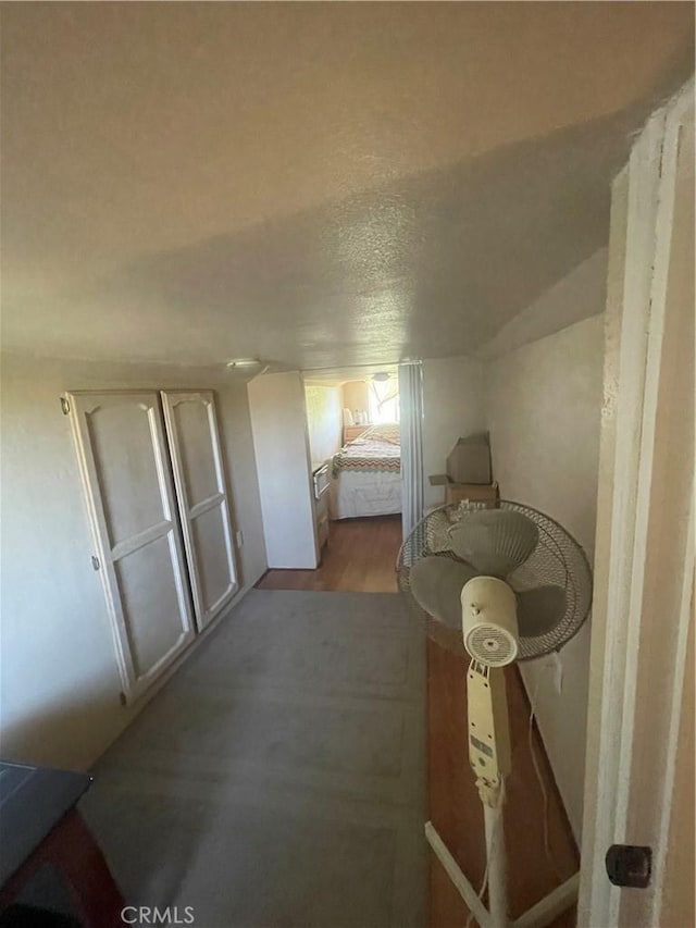 23171 Woodford Tehachapi Rd, Tehachapi, CA 93561 - bedroom with light wood-type flooring and a textured ceiling