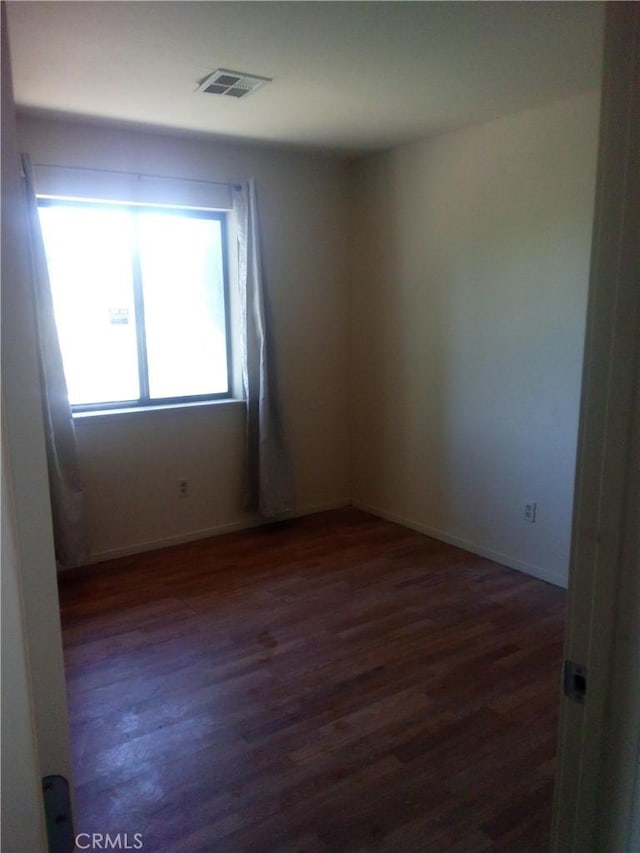 23171 Woodford Tehachapi Rd, Tehachapi, CA 93561 - unfurnished room with dark wood-type flooring and baseboards