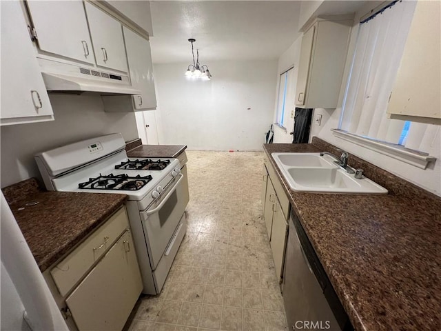 kitchen featuring a sink, under cabinet range hood, stainless steel dishwasher, dark countertops, and white range with gas stovetop