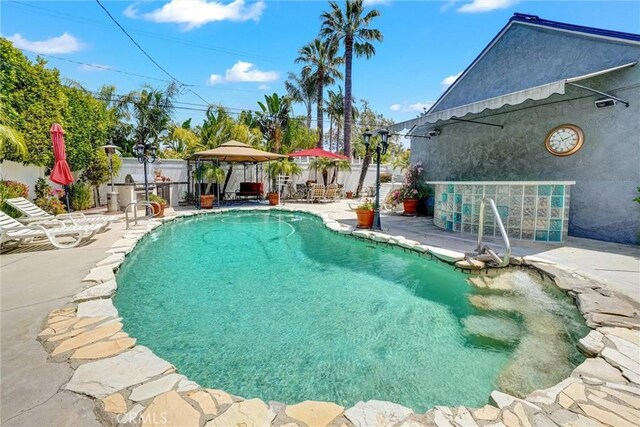 view of pool featuring a patio area, a fenced backyard, and a fenced in pool