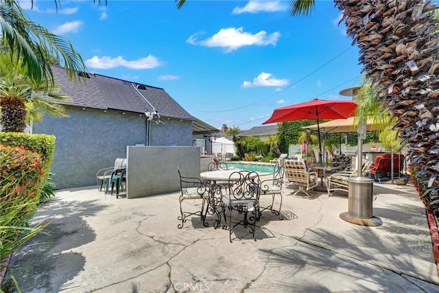 view of patio with an outdoor pool