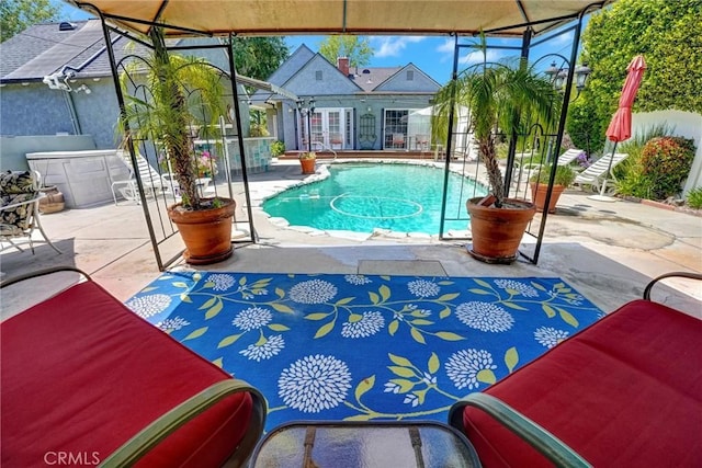 view of swimming pool with a patio and a fenced in pool