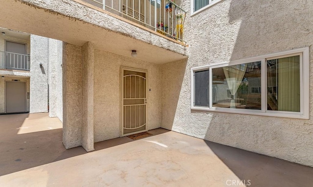 1344 5th St Unit 7, Glendale, CA 91201 - view of exterior entry with stucco siding, a patio, and a balcony